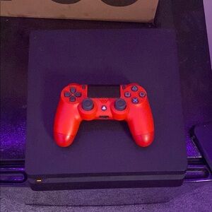Black PlayStation 4 / red PlayStation controller